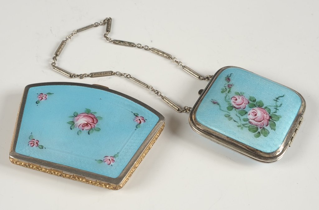 TWO BLUE GUILLOCHE DUO COMPACTS W PAINTED FLORALS: Square blue guilloche compact with hand painted roses on top, chain handle, hinged polished mirror over the rouge well in the lid, powder well in the base with rotary sifter, unmarked, measures 2 inch
