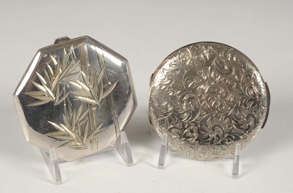 STERLING COMPACT W BAMBOO DESIGN, PLUS ANOTHER: Chased bamboo design, marked in the inside base, measures 3 inches, weighs 2.9 ozt. Plus an unmarked chased silvertone compact, measures 3 inches.