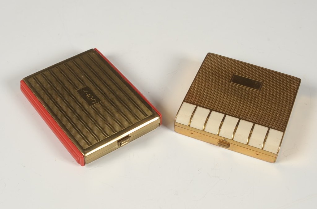 FRANCES DENNEY & COTY COMPACTS: Goldtone compacts with enamel or plastic decoration, measure 2.25 x 2.25 and 2.75 x 2.25 inches.