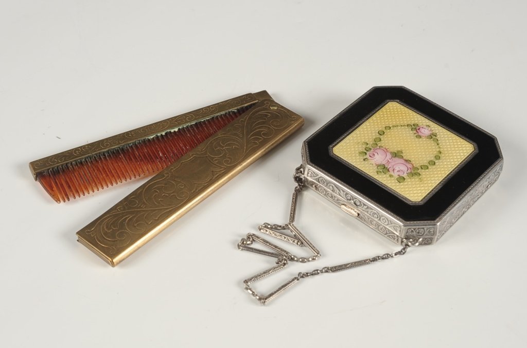 E.A.M. STERLING GUILLOCHE VANITY CASE & FLIP COMB: Black enamel vanity case in sterling with yellow guilloche and hand painted floral wreath, chain handle, framed mirror in the lid, base holds two small lipsticks in clips, rouge well with partial pan