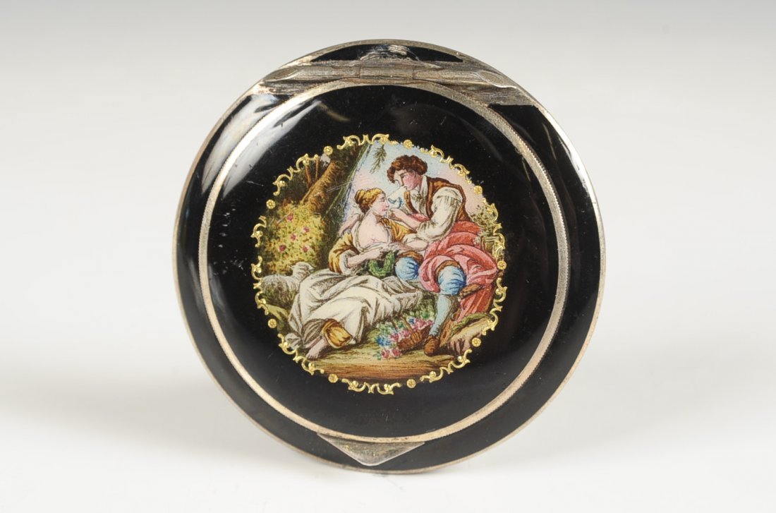 AUSTRIAN STERLING COMPACT W ENAMEL COURTING SCENE: Black enamel on sterling with a hand painted courting scene on top, framed beveled mirror in the lid, rotary sifter in the base, marked in the base, measures 2 inches, weighs 1.5 ozt.