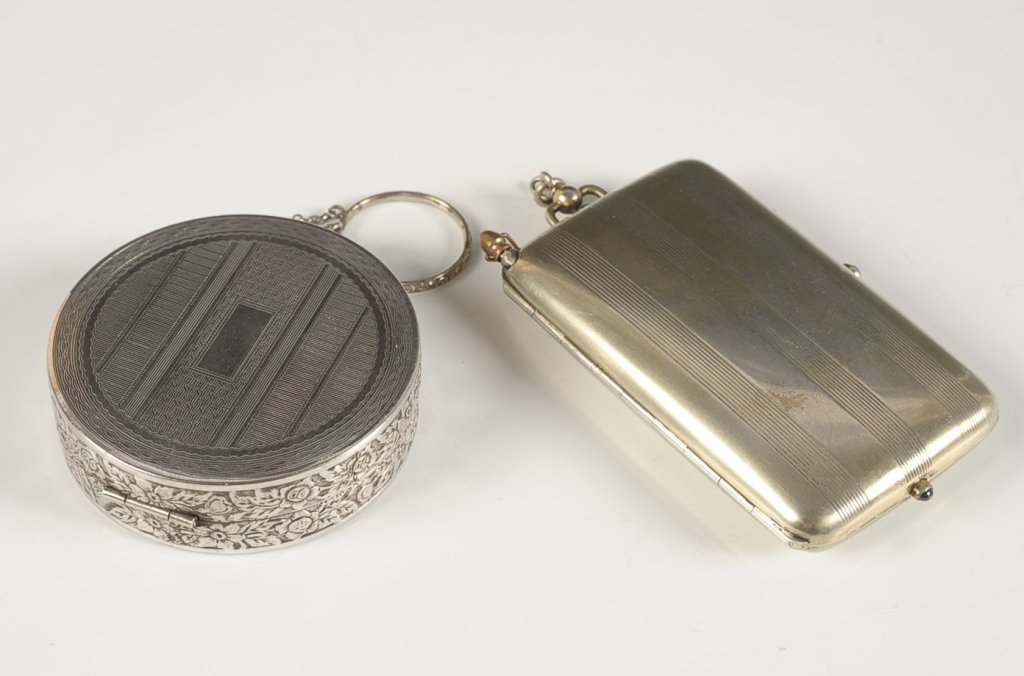 STERLING MINIAUDIERE, PLUS A DUO COMPACT: Sterling silver miniaudiere with an pencil in the top, hinged rouge and powder wells in the lid, cigarette compartment in the base with a hinged clip, hinged mirror frame over the compartment with the