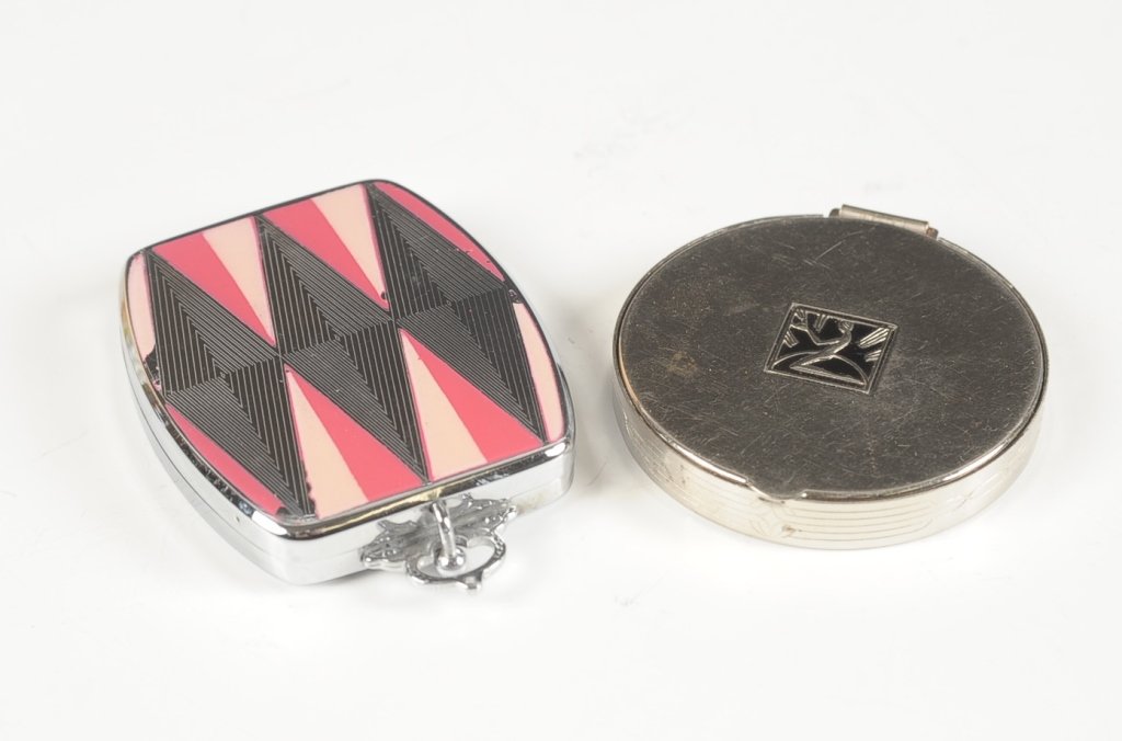 HUDNUT 'MARVELOUS' & E.A.M. ENAMELED COMPACTS: Richard Hudnut 'Marvelous' compact with an Art Deco nude on the lid, mirrored lid, puff and pan present, marked next to the hinge on the outside, measures 2 inches, good. Plus a E.A.M. enameled compac