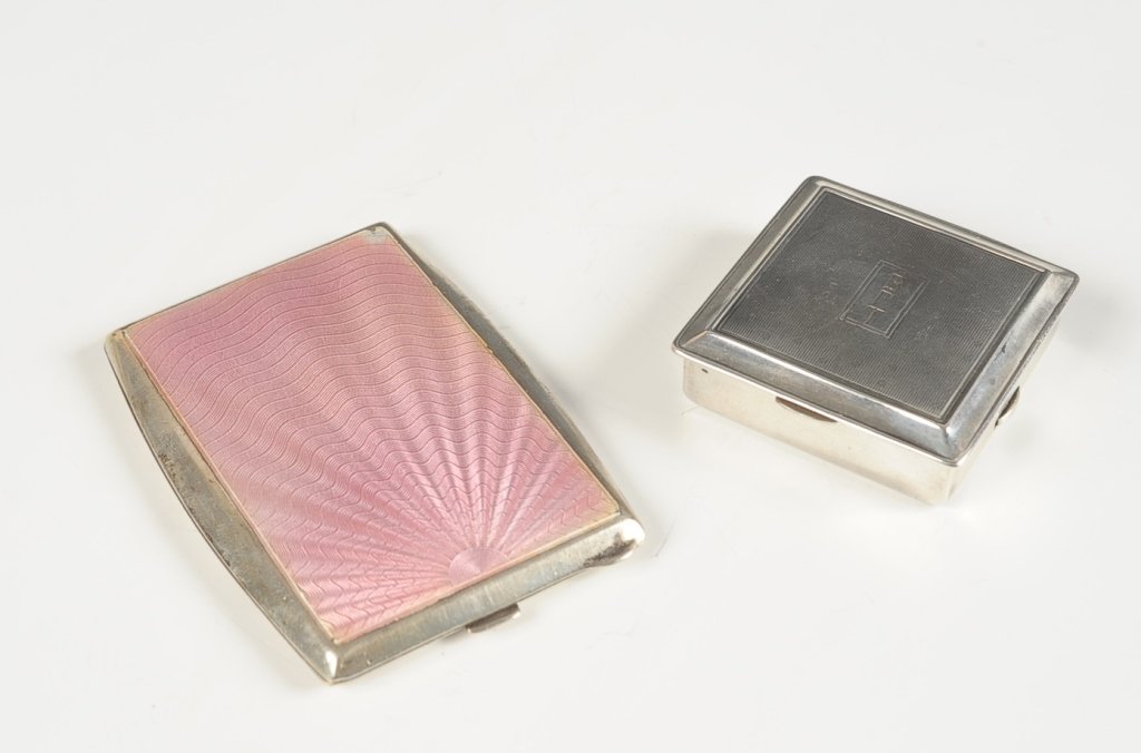 STERLING DUO COMPACT & STERLING GUILLOCHE COMPACT: Sterling duo compact with monogram on top and dated 1912-1937 on the bottom, polished metal mirror over a rouge well in the top, hinged powder well with pop up lid in the bottom, measures 1.75 inches,