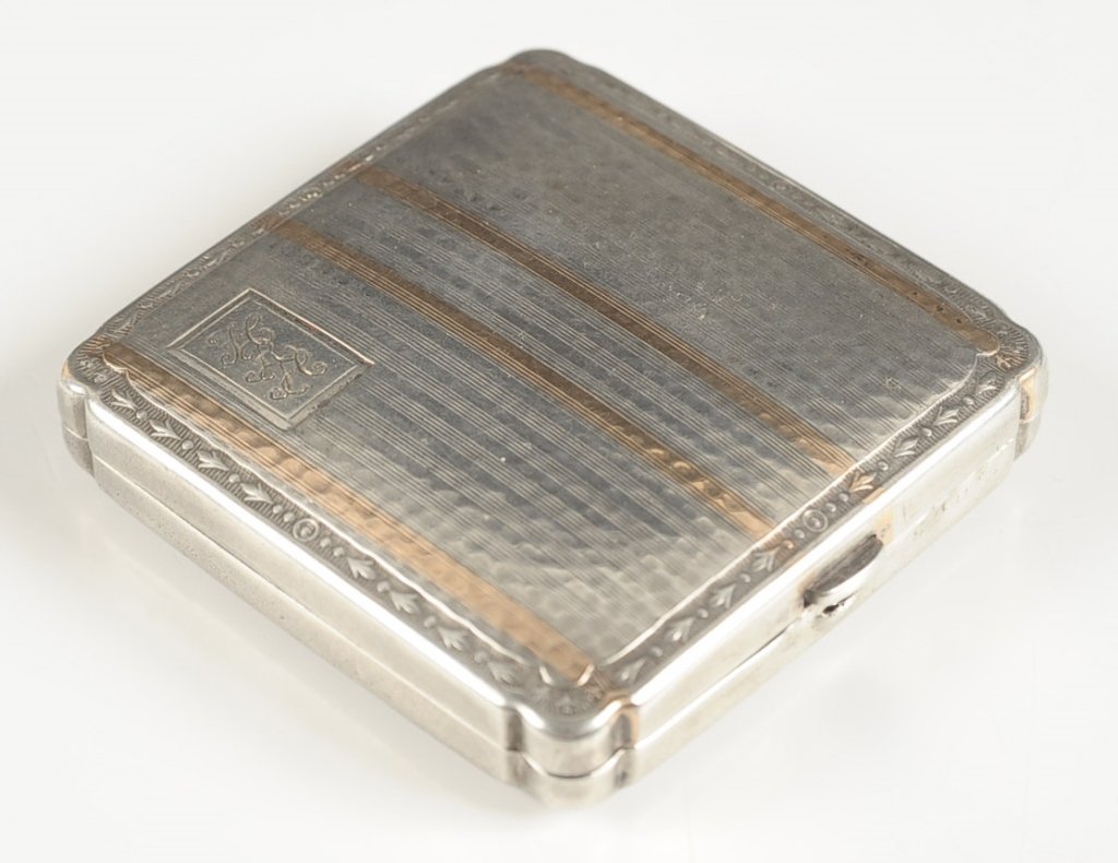 STERLING COMPACT WITH SLIDING POWDER DISPENSER: Monogrammed on top, framed mirror in the lid, sliding powder dispenser, measures 2.25 inches, weighs 2.3 ozt.