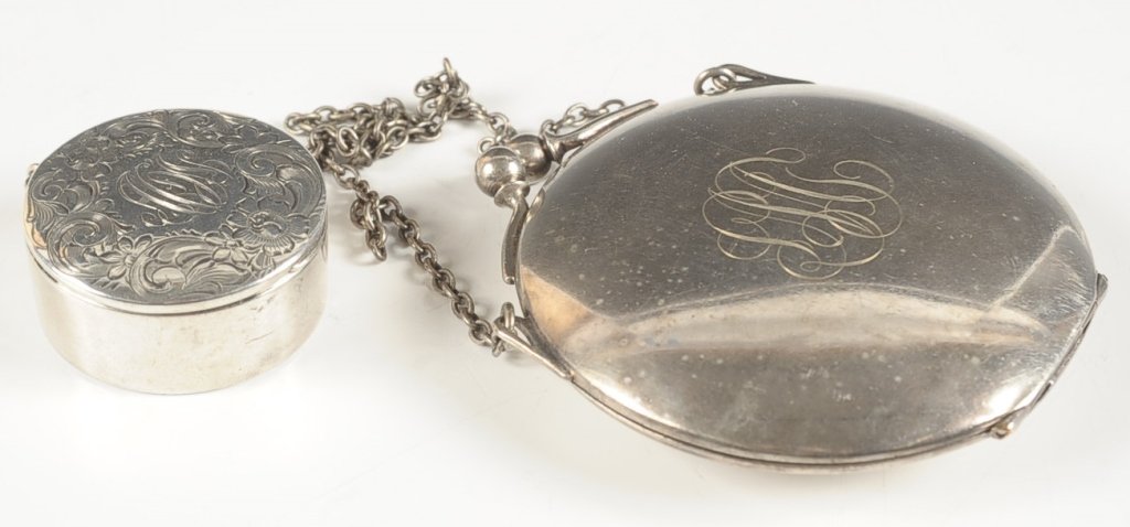 CHASED STERLING COMPACT AND F&B MINIAUDIERE: Chased sterling compact pendant, monogram on top, framed mirror in lid, puff and pan present, marked on the bottom, measures 1.5 inches, weighs .75 ozt., shallow dent on the lid. Plus a F&B miniaudier