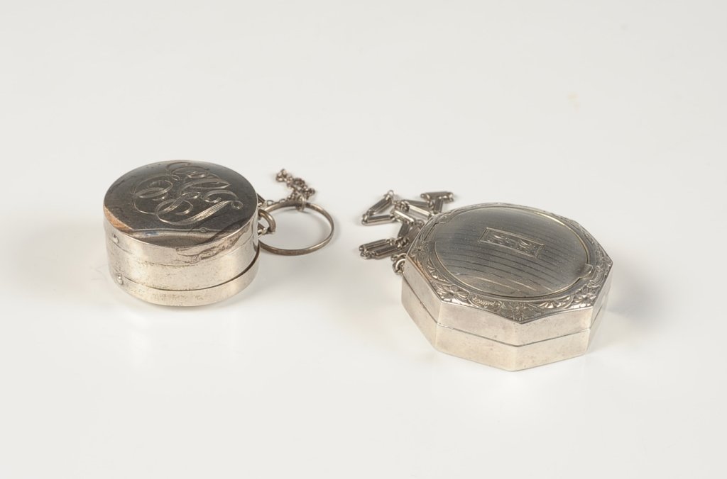 1922 INTERNATIONAL & F&B STERLING COMPACTS: F&B Co. sterling double-sided compact with chain and finger ring, mirror lids on both sides, monogrammed on one side, marked on the rim, measures 1.5 inches, weighs 1.25 ozt. Plus an International ste