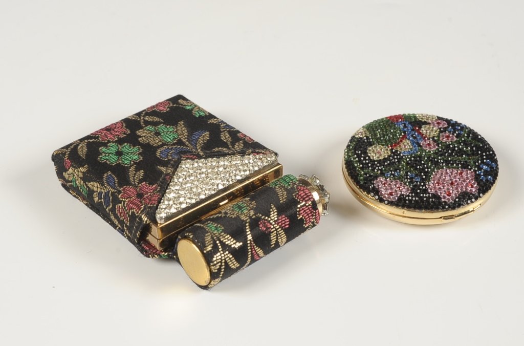 JUDITH LEIBER DESIGNER COMPACT & ZELL COMPACT: Judith Leiber designer compact with crystal floral design on top, framed mirror in the lid, branded puff and pan present, marked on the base, measures 2.25 inches, excellent. Plus a Zell Fifth Avenue