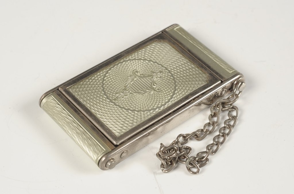 GIREY GUILLOCHE CAMERA STYLE VANITY CASE: Girey light green guilloche vanity case in a camera shape, slide out lipstick with a chain handle, pop up lid with mirror, rouge and powder wells in the base with pans and puffs, marked in the base, m