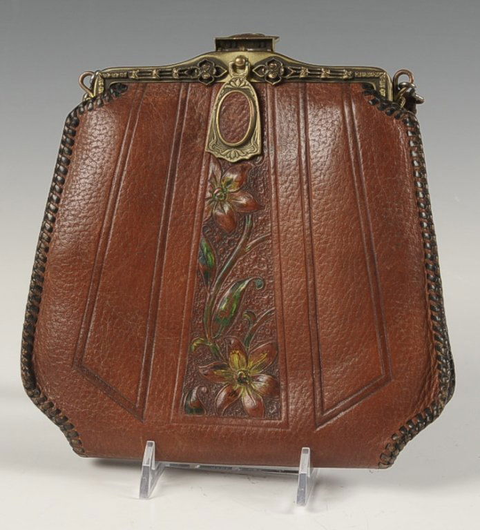 MEEKER ANTIQUE TOOLED LEATHER PURSE: Brass frame and hardware, leather handle, tooled leather body, suede interior with two pockets and a hand mirror, patent dated circa 1918, signed 'Meeker Made' on the interior leather, JFM Co. on the