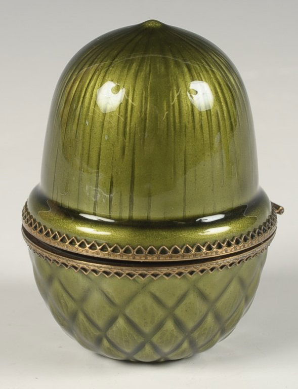 EVANS ENAMEL ACORN-SHAPED LIGHTER: Green enamel acorn opens to reveal a lighter in its base, marked on the inside base, measures 3 x 2.25 inches.