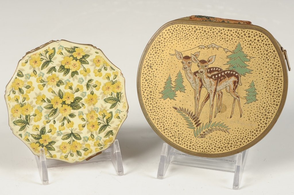 ARTIST-SIGNED COMPACT ANNETTE HONEYWELL & KIGU ENAMELED: Goldtone compact with zippered closure, enameled top with a two fawns signed 'Annette Honeywell', mirrored lid, mesh sifter, measures 3.5 inches, shallow scratches on the top. Plus a Kigu compact with