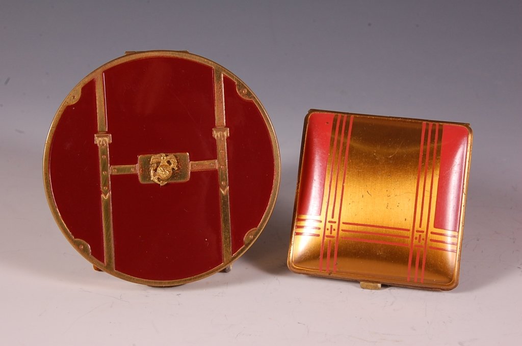 ZELL COMPACT W MARINE INSIGNIA & A CLARICE JANE COMPACT: Zell compact with red enamel and Marine insignia on the top, puff is present, marked on the powder well lid, measures 3 inches, good. Plus a red enamel on goldtone Clarice Jane duo compact with brande
