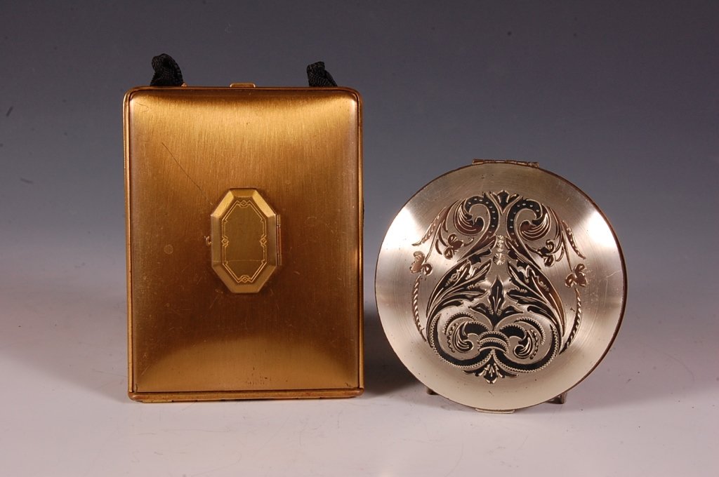 WADSWORTH COMPACT & MONDAINE MINIAUDIERE: Wadsworth silvertone compact with embossed design on top, framed mirror in the lid, hinged powder well with branded puff, marked on the powder well lid, measures 3 inches, very fine pitting on back, g
