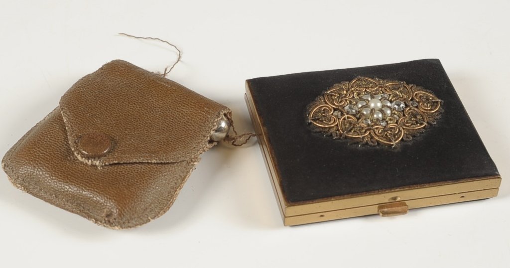 VELVETEEN COMPACT W JEWELED TOP & ENAMEL COMPACT: Velveteen covered compact with a jeweled top, goldtone base, mirrored lid, hinged powder well, unmarked, measures 2.5 x 3 inches, good. Plus an enameled compact with a matching lipstick in a tattered 