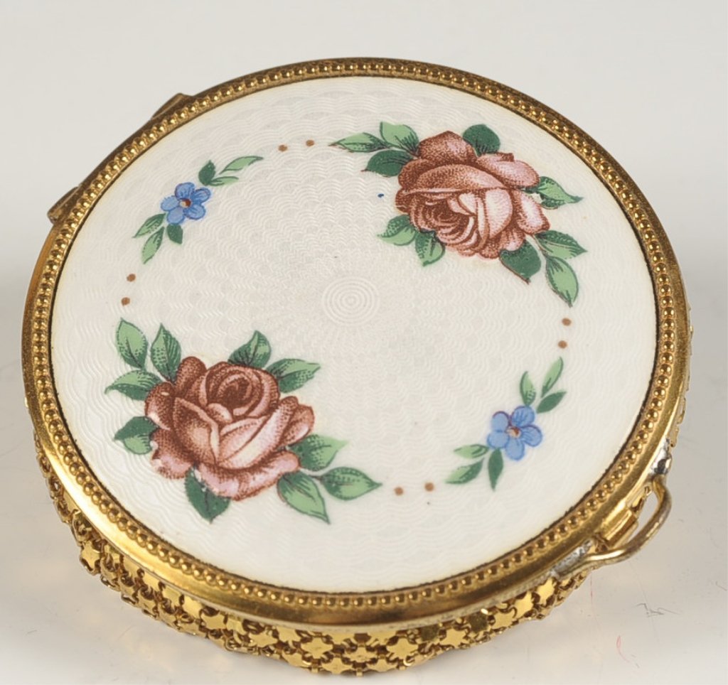 GUILLOCHE COMPACT WITH ARMOR MESH BOTTOM: Beveled mirror in the lid, mesh sifter and puff in the base, unmarked, measures 2.75 inches.