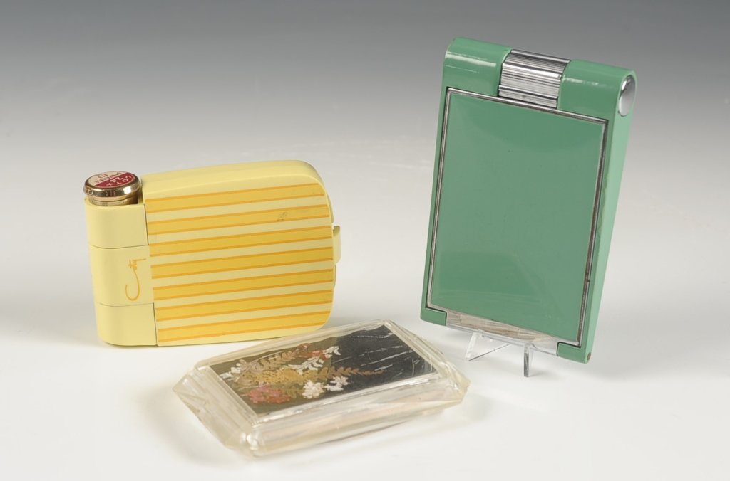 EVANS AIR-FLO, COTY & MAVCO PLASTIC COMPACTS: Evans Air-flo green plastic compact with an interesting clasp that twists to expose lipstick and rouge, beveled mirror in the pop up lid, mesh sifter and branded puff, marked on the mirror frame, incl