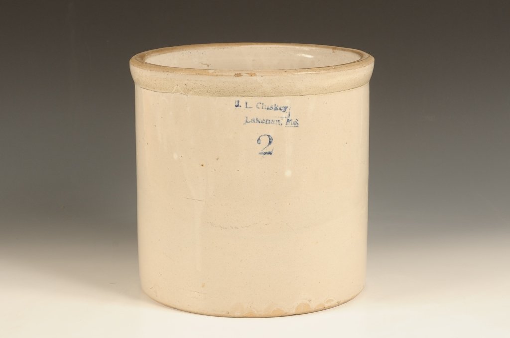 CLUSKEY LAKENAN MISSOURI AND REDWING STONEWARE CROCKS: A Cluskey Lakenan Missouri two gallon Bristol glaze crock with blue stenciled mark. Measures 9.5 x 9.5 inches in diameter. Good condition noting glaze miss at the rim. Also a RED WING TWO GALLON STONE
