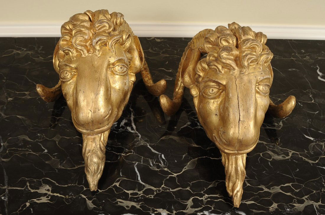 18TH C. CARVED AND GILDED WOOD GOAT'S HEAD ORNAMENTS: A great pair of furniture or architectural elements with their original gessoed and gilded finish on carved wood. Nice detail, character, surface and condition. Approximately 12.5 x 9 inches.