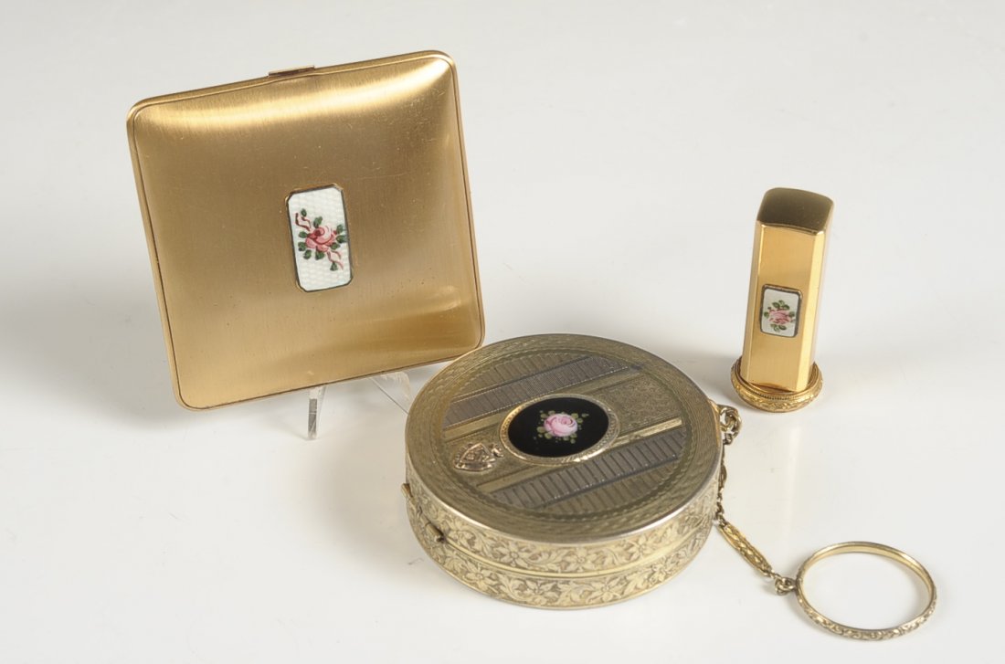 BLISS LIPSTICK & COMPACT SET & DUO COMPACT W ENAMEL: Bliss compact in goldtone with enameled bottom and guilloche with hand painted rose on top, polished metal mirror, hinged rouge with pan and puff and hinged powder well with branded puff in the base, 