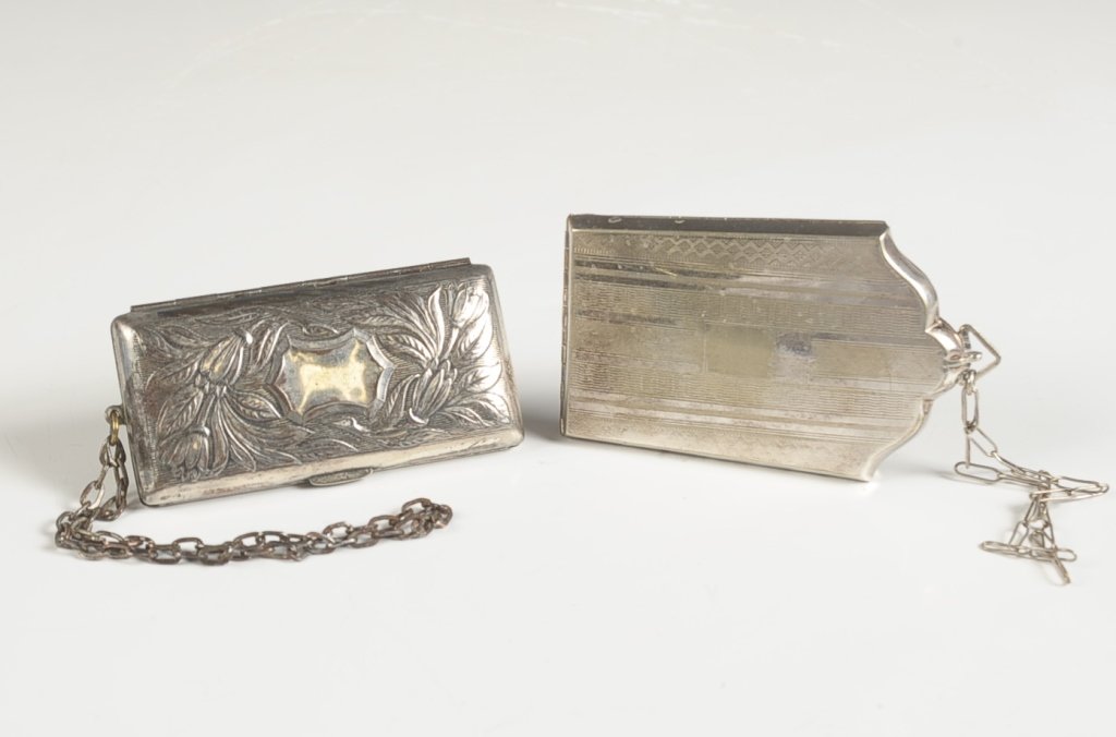VINTAGE MINIAUDIERE AND DUO COMPACT: Silvertone with chain handles, miniaudiere has a money clip in the lid, base with hinged mirror over a powder well and two change holders, marked nickel silver, measures 3.75 x 2.25 inches. Duo compac
