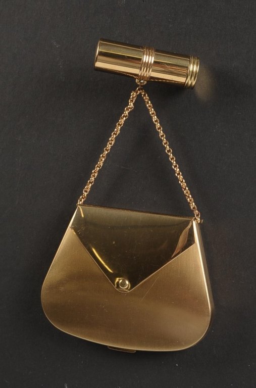 VINTAGE VOLUPTE PURSE-SHAPED COMPACT W LIPSTICK FOB: Brushed goldtone compact with a rouge well under the purse flap with pan and puff, framed mirror in the lid, hinged powder well, branded puff, marked on the powder well lid, chain handle with a lipsti
