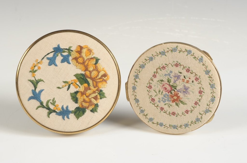 ENGLISH CREWEL WORK COMPACT & A PETIT POINT COMPACT: Duplex-Unique' English crewel work linen compact with an interesting hinged vanity mirror over the powder well, a framed mirror is also present in the lid, mesh sifter and puff, marked on the mirror f