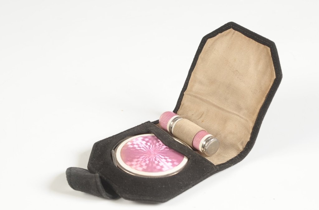 STERLING GUILLOCHE COMPACT & LIPSTICK SET W CASE: Pink guilloche and white enamel on sterling compact and lipstick with a black suede carry case, compact has a framed mirror in the lid, rotary sifter in the base with a puff, marked under the sifter, 