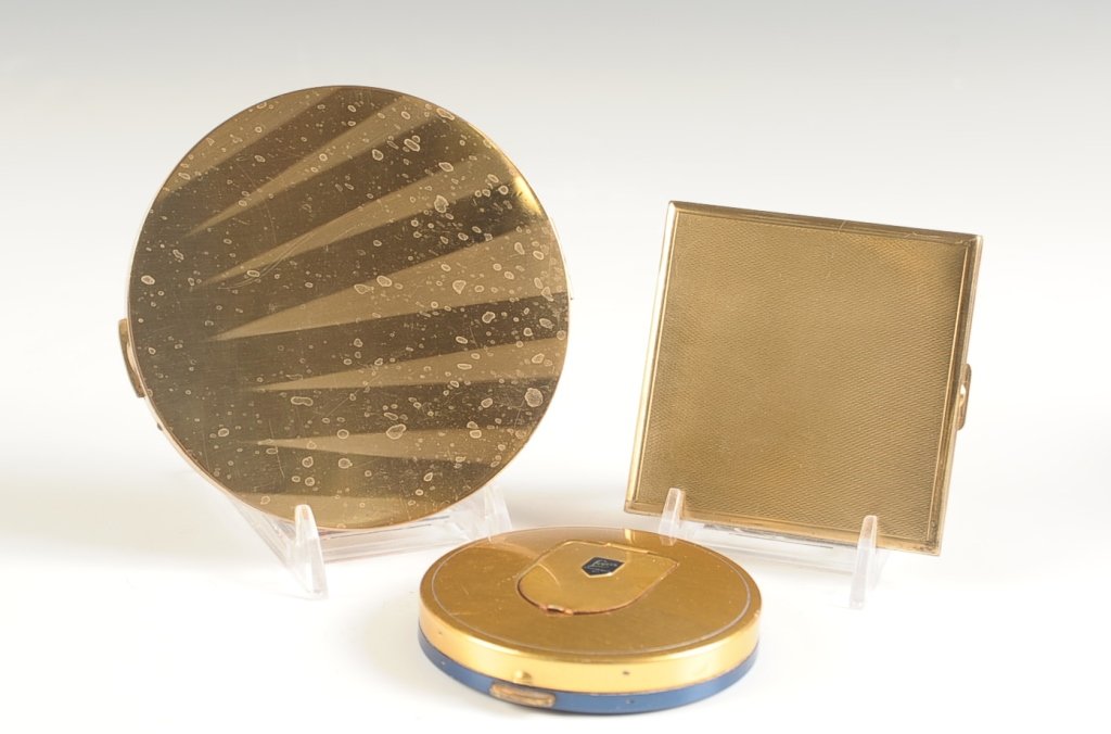 LUZIERS KANSAS CITY, EMRICH & KARNEE COMPACTS: Three goldtone compacts ranging in size from 3 inches, up to 4.25 inches.