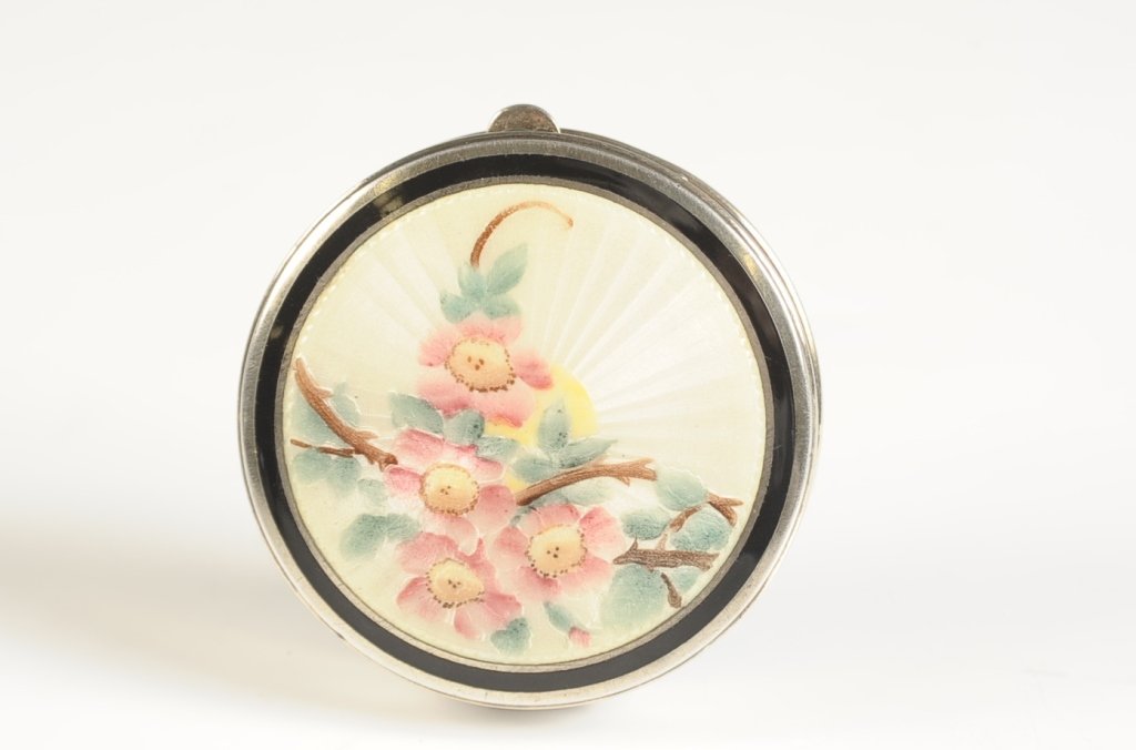 F&B STERLING GUILLOCHE DUO COMPACT: Black enamel and white guilloche on sterling with a hand painted floral design on top, hinged pop up mirror over the powder well in the base with a writing pad on the other side with the address of 'E