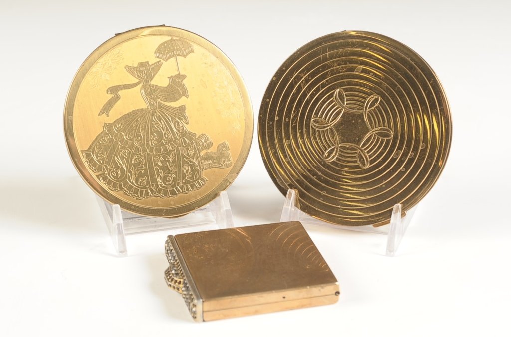 DOROTHY GRAY, WADSWORTH & A JEWELED COMPACT: Three goldtone compacts ranging in size from 2.5 x 2.25 inches, up to 3.5 inches.
