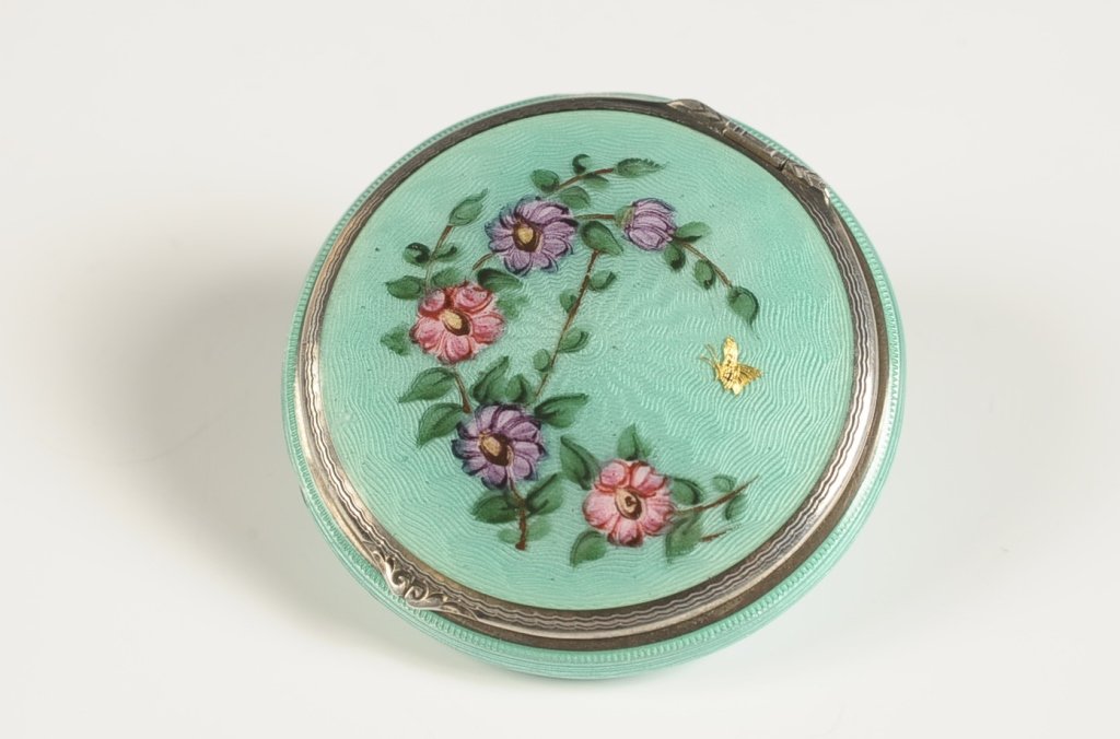 1926 F&B STERLING GUILLOCHE COMPACT: With hand painted floral and gold butterfly on top, pop up mirror over a powder well in the base, rouge well with pan in the lid, marked on the rouge well, patent dated 1926, measures 2 inches, weighs