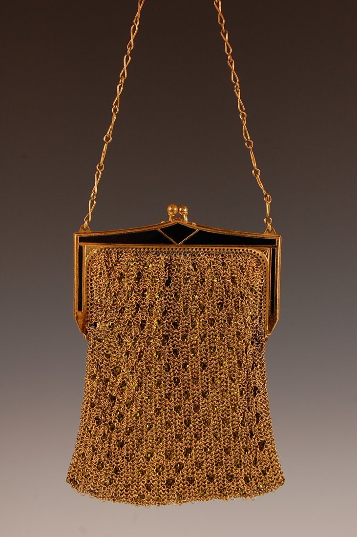 WHITING AND DAVIS RING MESH OVER ARMOR MESH PURSE: Goldtone ring mesh with an enameled frame over a green/gold armor mesh for an interesting effect, chain handle, marked on the inside frame, measures 11 x 4 with a 5.5 inch drop from handle.