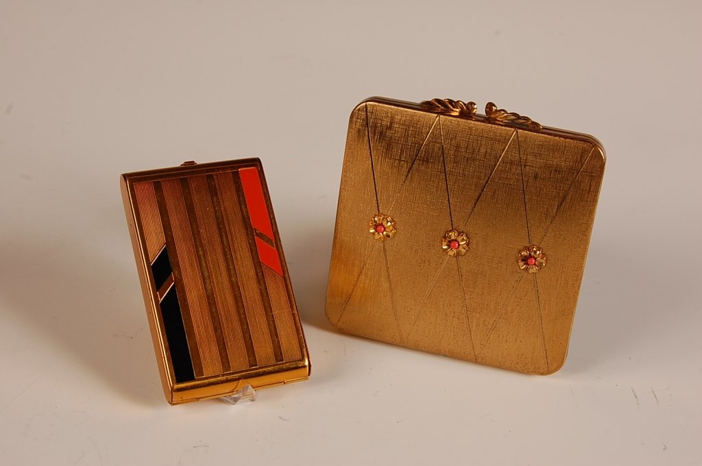 VOLUPTE JEWELED COMPACT & VALAZE VANITY CASE: Volupte goldtone vanity case with jeweled flowers on top, framed mirror in the lid, hinged powder well with branded puff, marked on the powder well lid, measures 3.25 x 3 inches, very good. Plus a Val