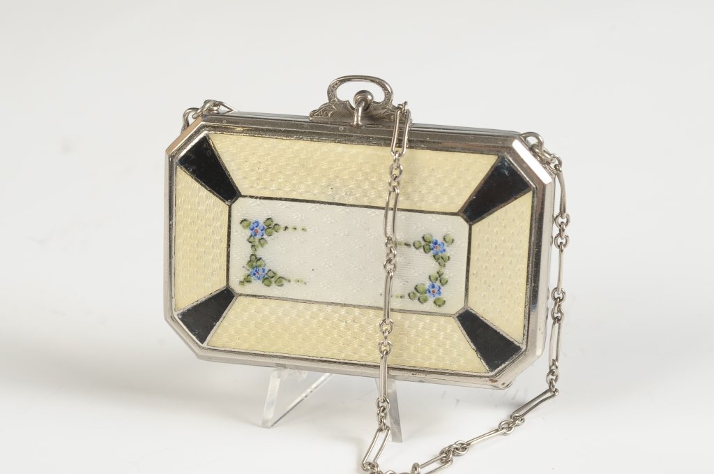 E.A.M. GUILLOCHE DUO COMPACT: Yellow and black guilloche with painted florals, chain handle, mirror in the lid, rouge and powder wells in the base with pans and one puff, marked on the base, measures 1.75 x 2.75 inches, with a 4 i