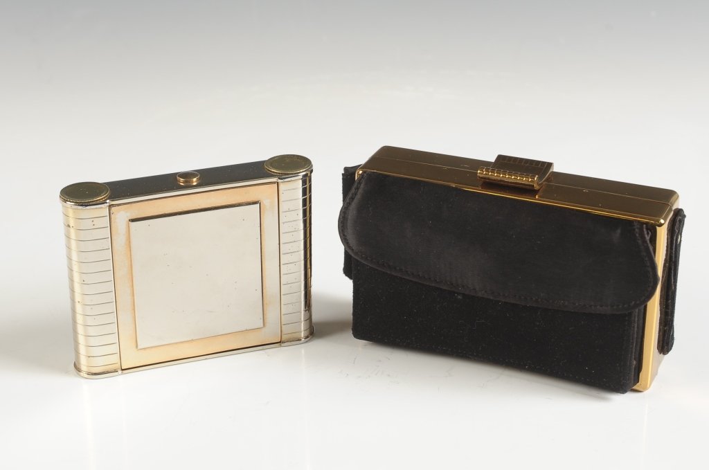 ELGIN AMERICAN MINIAUDIERE & VENUS RAY LIGHTED COMPACT: Satin and goldtone Elgin American miniaudiere, outer pocket with comb, hinged mirror over a cigarette compartment in the lid, two hinged wells in the base one with branded puff and mesh sifter, lipsti