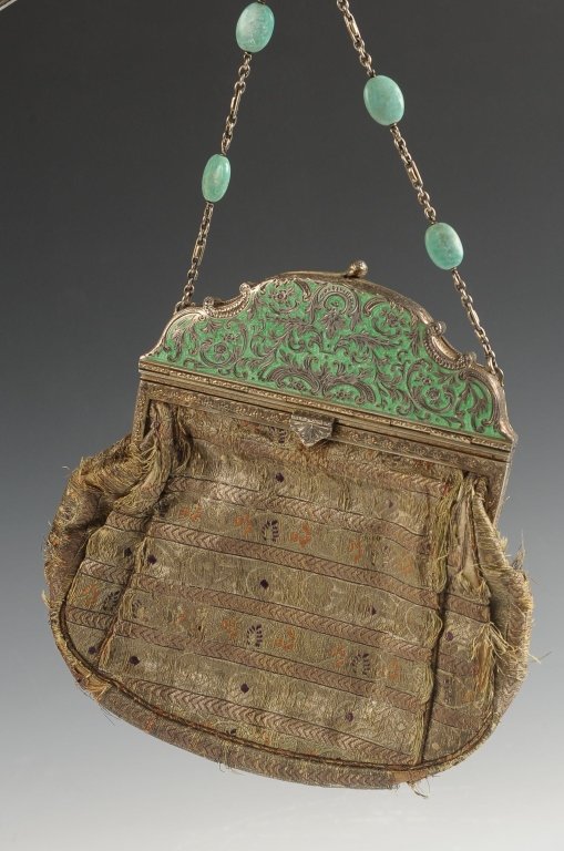 AUSTRIAN STERLING CHAMPLEVE ENAMEL PURSE W BROCADE: Champleve enamel top on sterling opens to reveal a vanity case top with two hinged wells and a pop-up lipstick, jeweled chain handle, brocade purse bottom with satin lining, marked in the powder wells