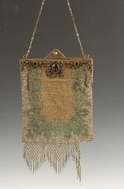 FRENCH STEEL BEADED BAG W FILIGREE & JEWELED FRAME,: Antique French beaded bag with an ornate filigree and jeweled frame, chain handle, beaded fringe is detached from one side, tattered satin lining, marked with a satin tag, measures 10 x 6 inches with