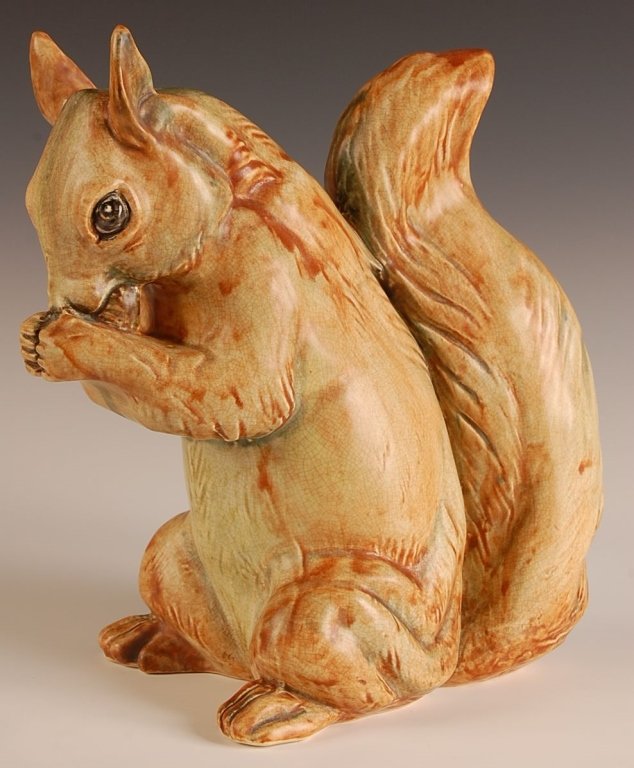 WELLER SQUIRREL GARDEN ORNAMENT: Marked with the half kiln inkstamp, measures 12 x 6.25 x 11.25 inches. Please note that this item will be shipped by our in-house shipping department and is subject to a 14 day return policy guarantee