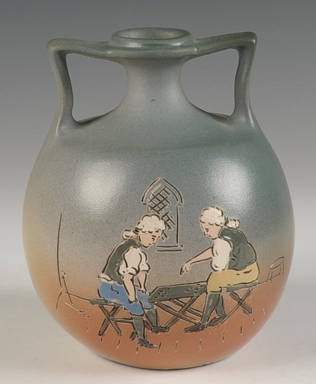 WELLER DICKENS WARE TWO HANDLED VASE: Impressed half round Weller Dickens Ware mark, measures 5 x 4 inches. Please note that this item will be shipped by our in-house shipping department and is subject to a 14 day return policy guarantee.