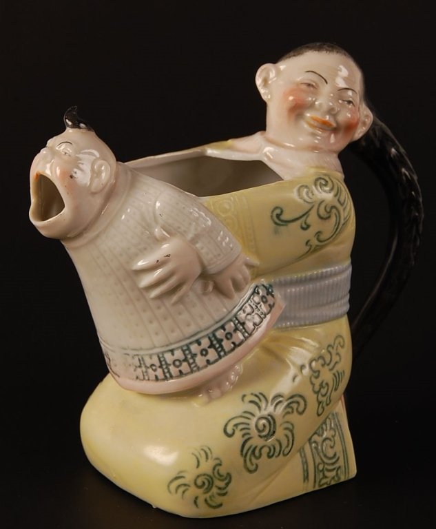 SCHAFER & VATER CHINAMAN & CRYING BABY CREAMER: Color glaze, impressed mark, measures 4.25 x 4.5 inches. Please note that this item will be shipped by our in-house shipping department and is subject to a 14 day return policy guarantee. If any piece