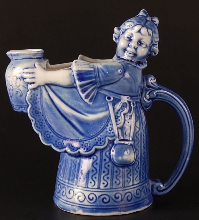 SCHAFER & VATER BLUE MAID WITH JUG CREAMER: Impressed mark, measures 5.5 x 5.5 inches. Please note that this item will be shipped by our in-house shipping department and is subject to a 14 day return policy guarantee. If any piece in this lot i