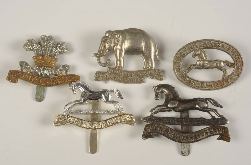 SIXTEEN BRITISH HUSSAR UNIT CAP BADGES: Includes The Queen's Own, 13th, three 26th Hussars, 14th King's (pre-1915 and 1915-1929 varieties), 10th Royal, 11th, three 4th Queen's Own, 3rd King's Own, 19th Alexandra P.W.O. Hussars, 7th Queen's