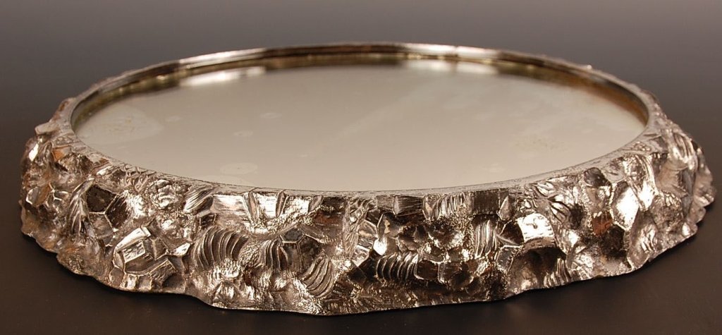 SILVER PLATED PLATEAU MIRROR WITH ROCKY CRAG DESIGN: Measures 16.5 inches in diameter.