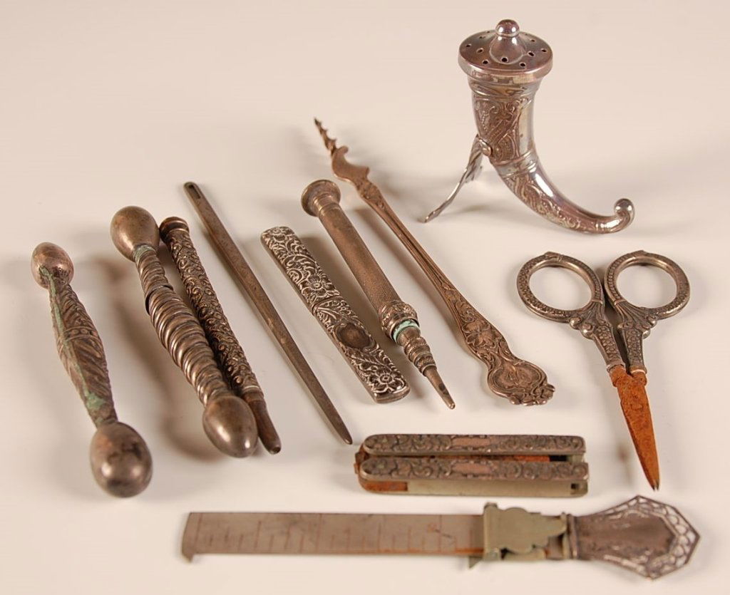 ANTIQUE STERLING SILVER SEWING AND OTHER ITEMS: Including two glove darners, needle case, mechanical pencils, folding scissors, etc. Group ranging in size from .25 inches in length, up to 5 inches in length.