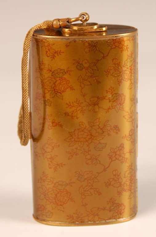 GOLDTONE MINIAUDIÈRE: Mess chain handle, printed floral design, hinged mirror over a cigarette well with money clip and comb compartment and a lipstick, lid holds hinged powder and rouge wells, crumbing rouge pan and mesh 