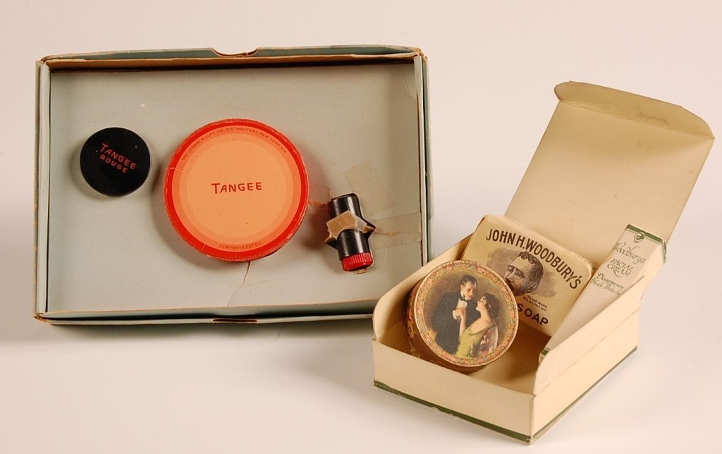 TANGEE & WOODBURY BOXED COSMETICS SETS: Tangee set with rouge, powder and lipstick, measures 4.5 x 6.5 inches, box shows some wear and stains. Plus a John H. Woodbury's boxed cosmetics set with facial soap, cream and powder, measures 3.5 x 