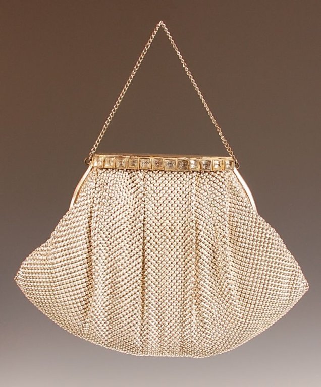 VINTAGE ARMOR MESH PURSE: Crystal clasp monogrammed on top, chain handle, satin lining with a satin compact and a comb, measures 9 x 8.5 with a 3.75 inch drop from handle.
