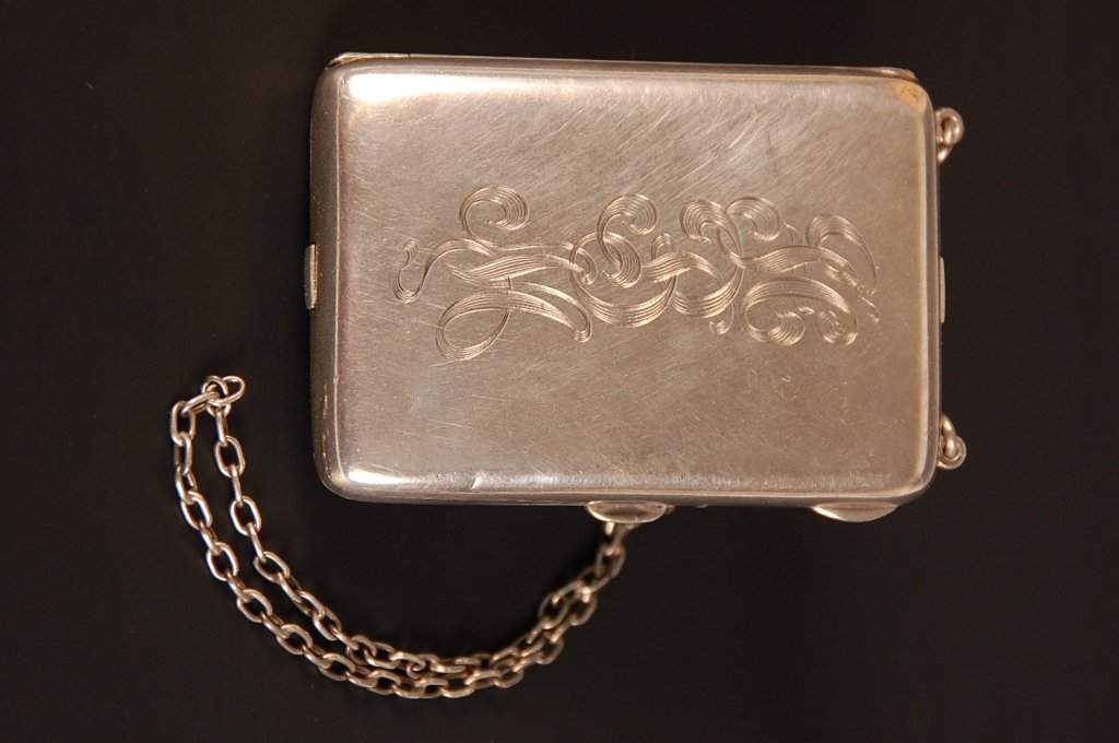 R. BLACKINTON CO. STERLING VANITY CASE: Monogrammed on top, mirrored lid in the base, chain handle, two hinged wells in the lid, dedicated 'Hazel Myers 458 Melrose St. Chicago', measures 3.25 x 2 inches, weighs 4.2 ozt.