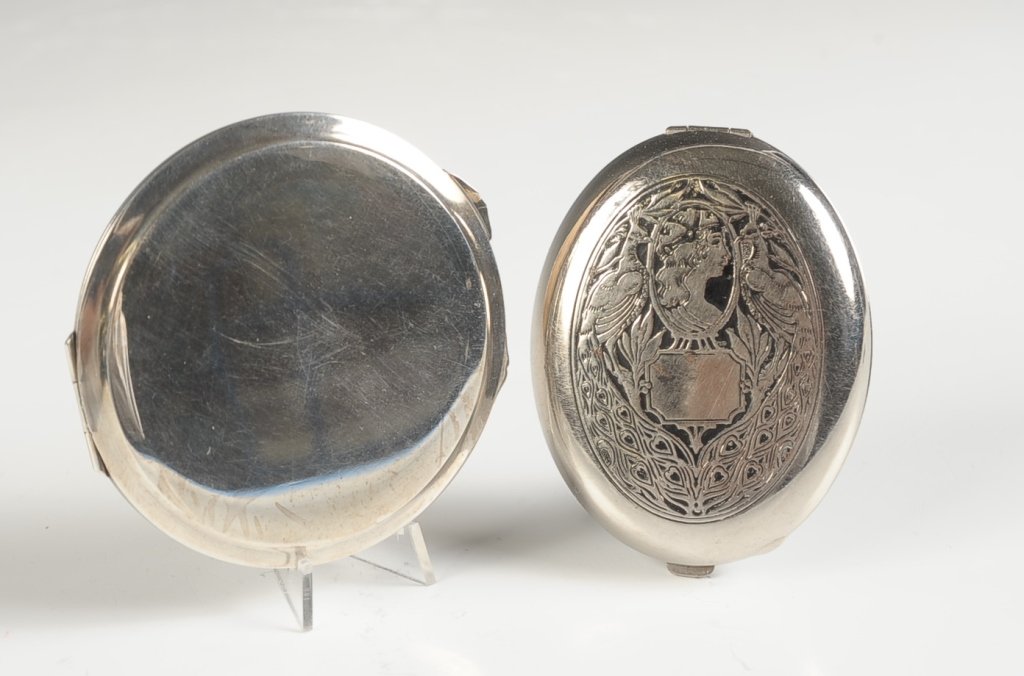 FITCH ART NOUVEAU VANITY CASE & A COMPACT: Two silvertone pieces, Fitch vanity case with rouge, powder and lipstick measures 2.75 x 2 inches, unmarked compact measures 2.75 inches.